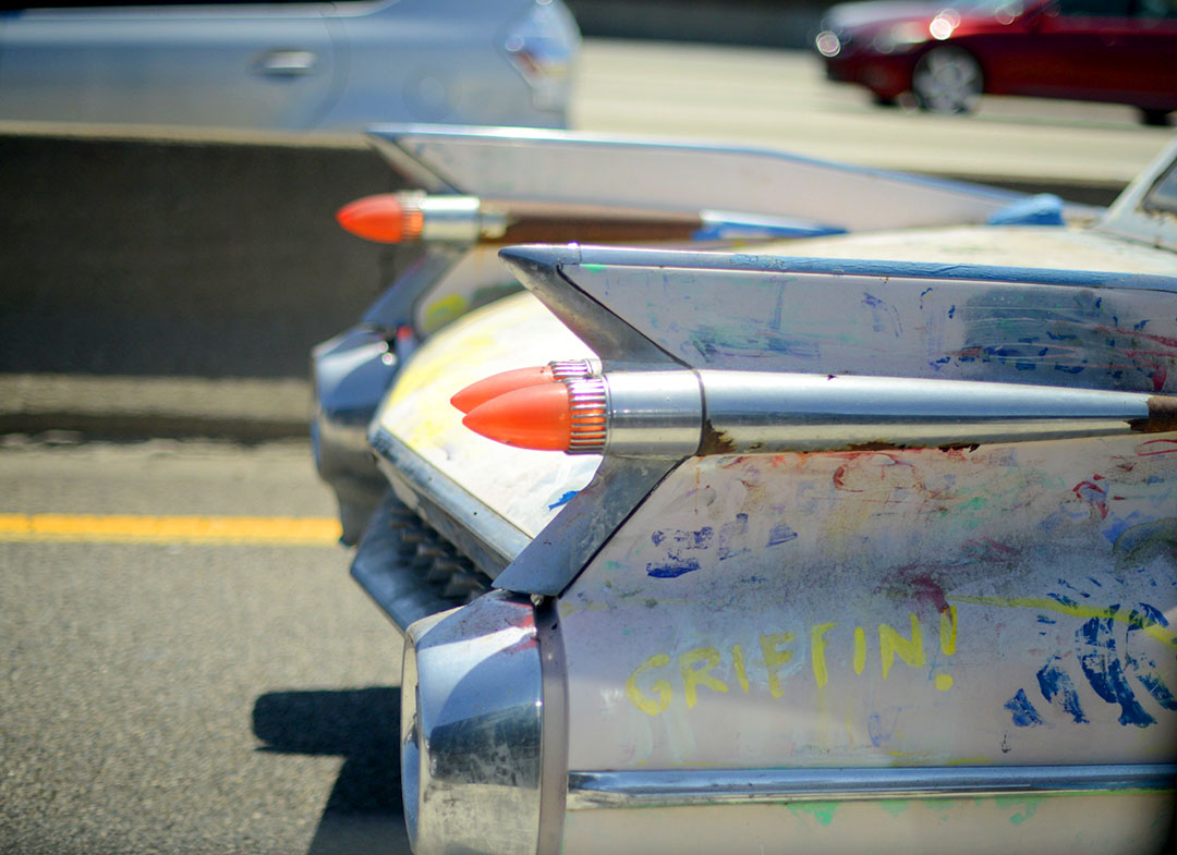 vintage car on the highway in LA photographed by sara delaney