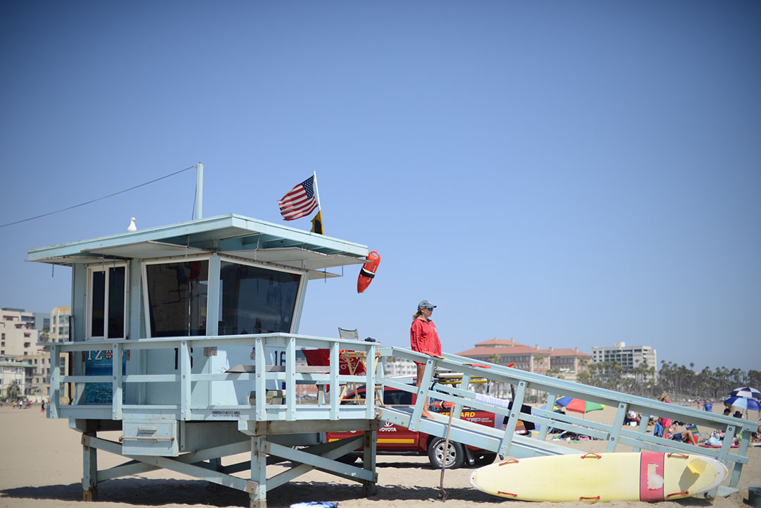 lifeguard on duty on santa monica beach photographed by sara delaney