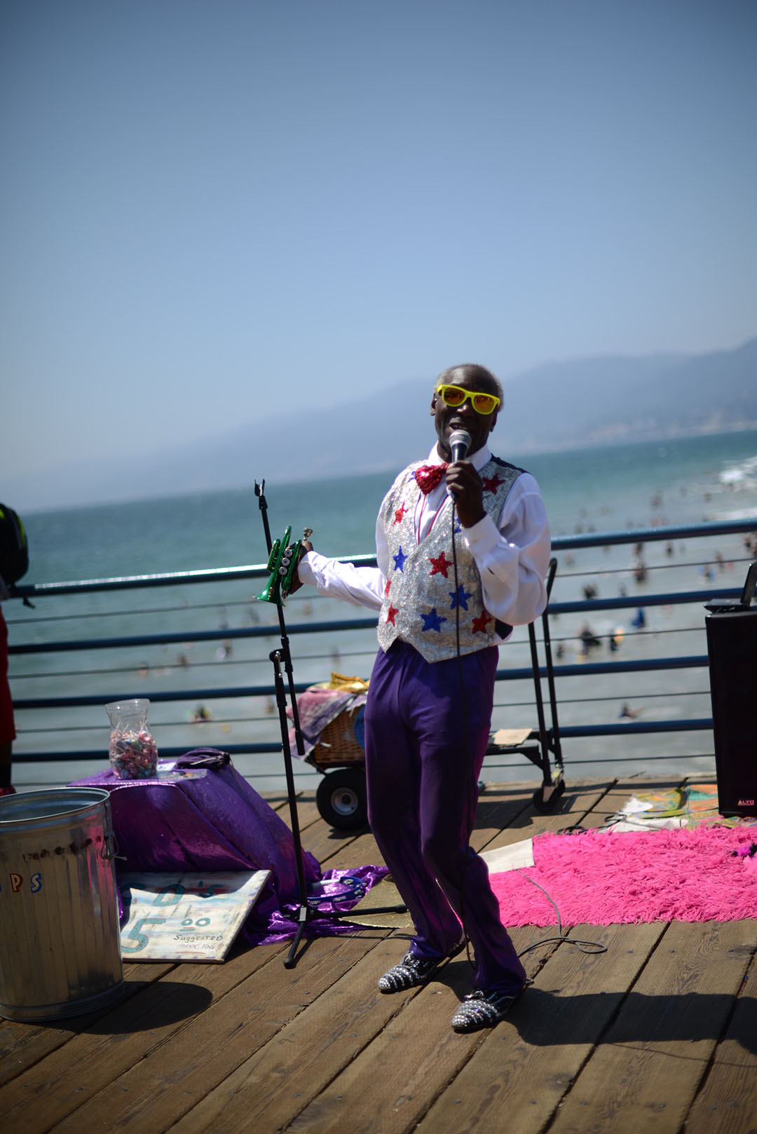 busker singing at santa monica pier photographed by sara delaney
