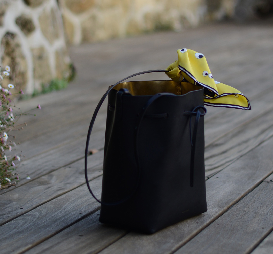 mansur gavriel bucket bag with anya hindmarch scarf photographed by sara delaney