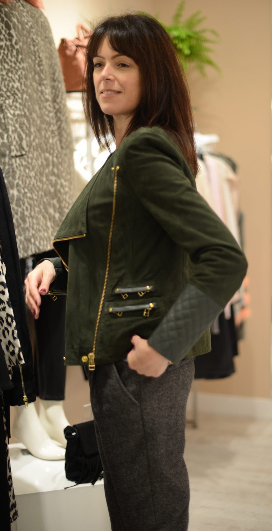 michelle tyler tries a jacket at the dressing room in st albans