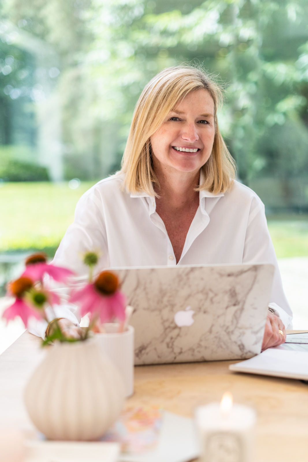 female interior designer at her desk during a personal branding photography shoot in guildford